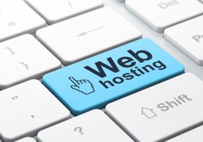 Web development concept: computer keyboard with Mouse Cursor icon and word Web Hosting, selected focus on enter button, 3d render